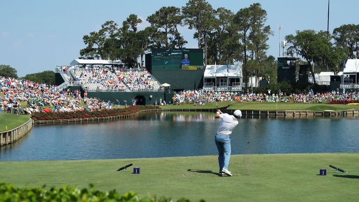 17th hole challenge using left-handed club and putter